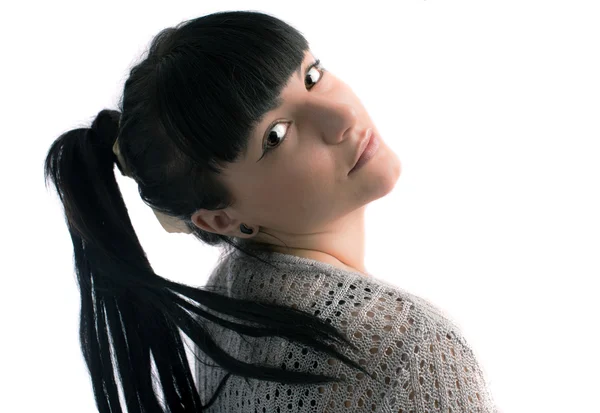 Portret van een jonge brunette in studio op witte achtergrond — Stockfoto