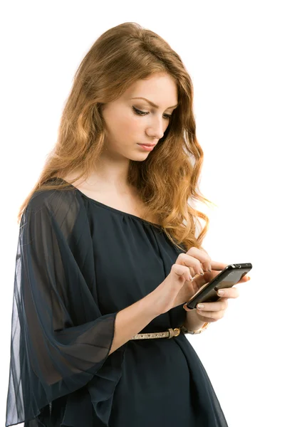 Beautiful young woman looks in phone isolated on white backgroun — Stock Photo, Image