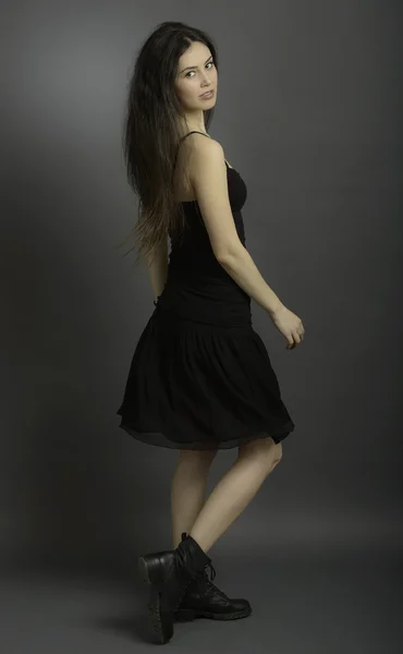 Portrait of beautiful brunette woman in black dress — Stock Photo, Image