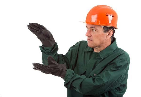 Portrait of a workman in overalls and helmet showing different g — Stock Photo, Image