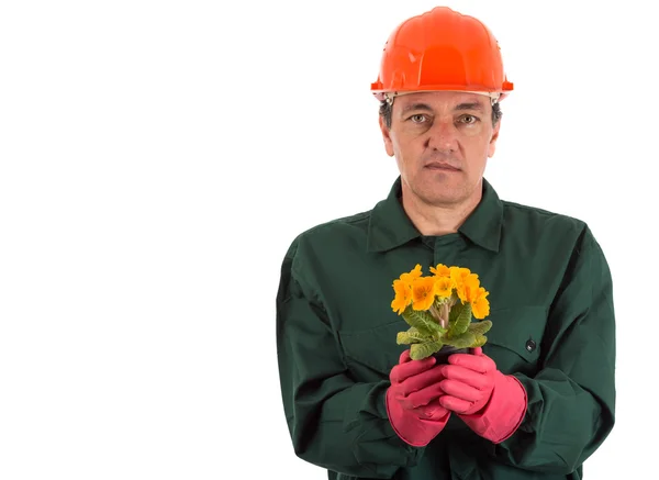 Jardinier avec un pot de fleurs à la main — Photo