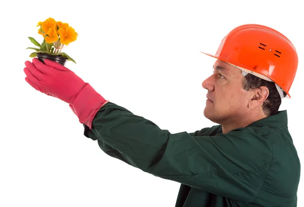 Jardinier avec un pot de fleurs à la main — Photo