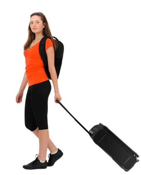 A beautiful woman tourist with luggage isolated on white backgro — Stock Photo, Image