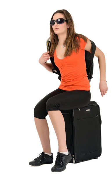A beautiful woman tourist with luggage isolated on white backgro — Stock Photo, Image