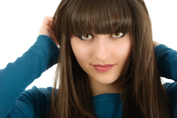 Eine schöne Frau mit langen Haaren im Studio isoliert auf weißem Bac — Stockfoto