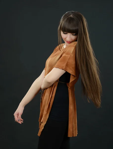 Portrait of a young beautiful woman with bangs in studio — Stock Photo, Image