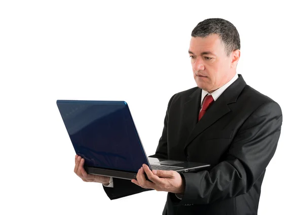 Older businessman with a laptop isolated on white background — Stock Photo, Image