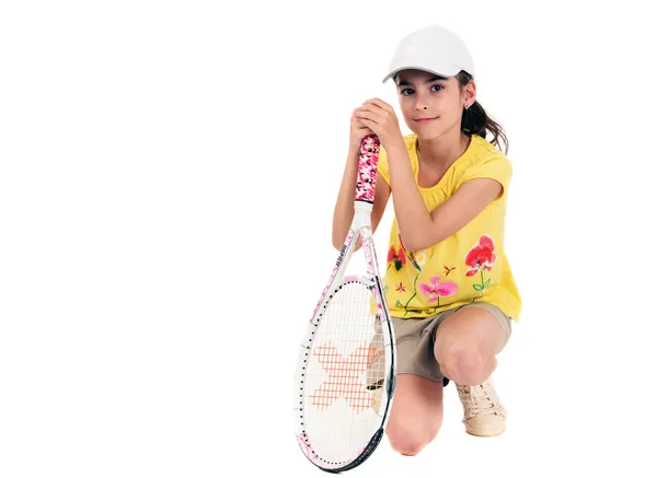 Petite fille avec des jeux de tennis sur un fond blanc — Photo