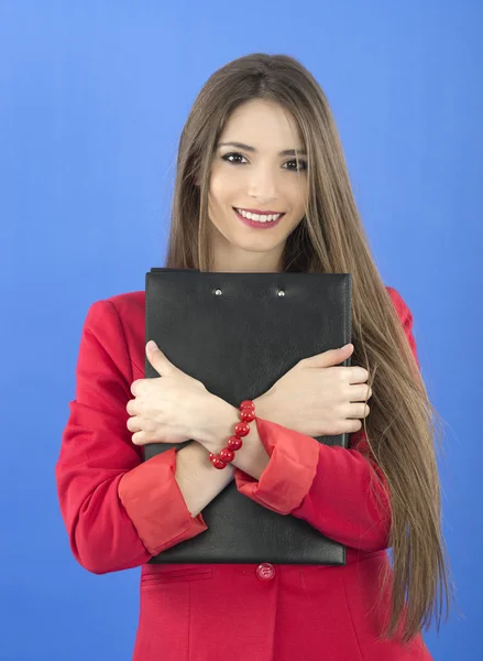 Portrait of urban business woman wearing tie, isolated on blue — Stock Photo, Image