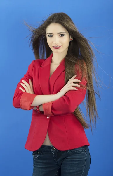 Portrait of urban business woman wearing tie, isolated on blue — Stock Photo, Image