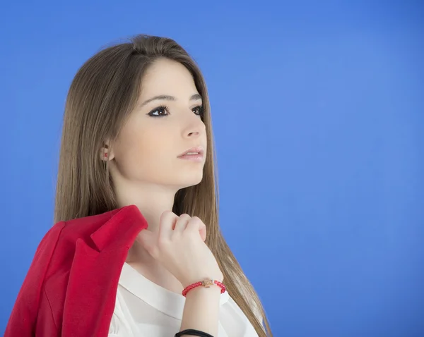 Portrait of urban business woman wearing tie, isolated on blue — Stock Photo, Image