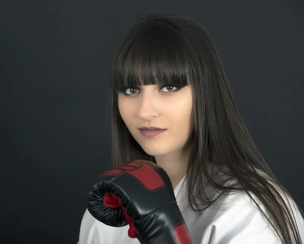 Karateka asian girl on black background studio shot — Stock Photo, Image