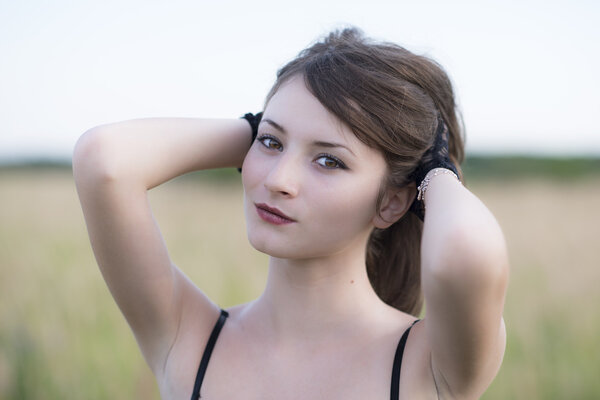 Romantic young woman posing outdoor.