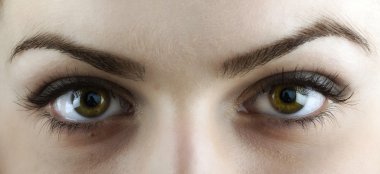 Beautiful young woman's eyes close-up clipart