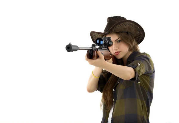 Young beautiful woman holding a gun on white background — Stock Photo, Image