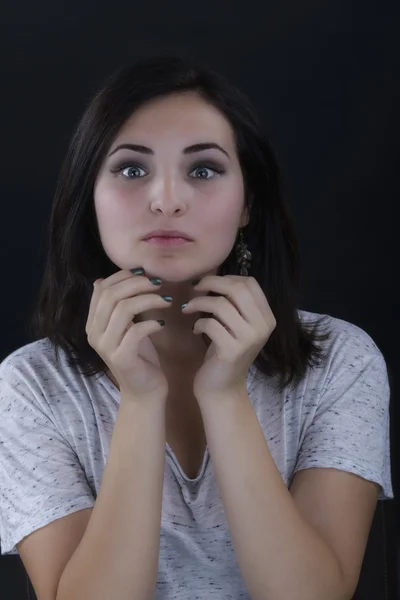 Closeup portrait of a beautiful lady on black — Stock Photo, Image