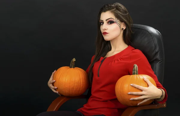 Young woman holding orange pumpkin close up,isolated — Stock Photo, Image