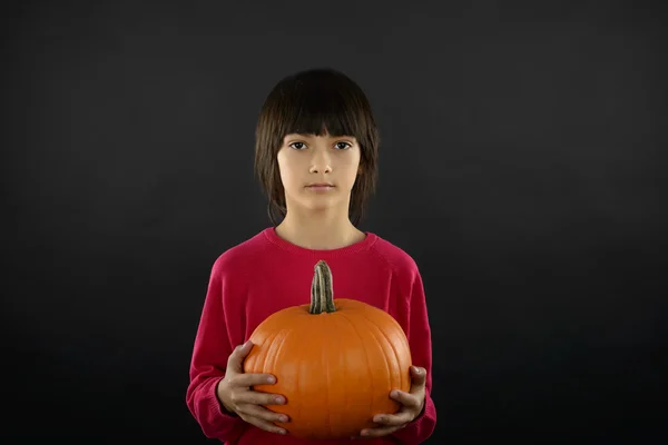 Portrait of little boy wearing halloween costume with pumpkin on — Stock Photo, Image