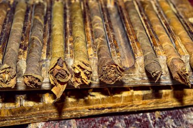 traditional handmade cigars in storage press clipart
