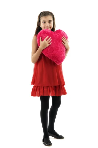 Niña sosteniendo el corazón rojo, primer plano aislado en blanco — Foto de Stock