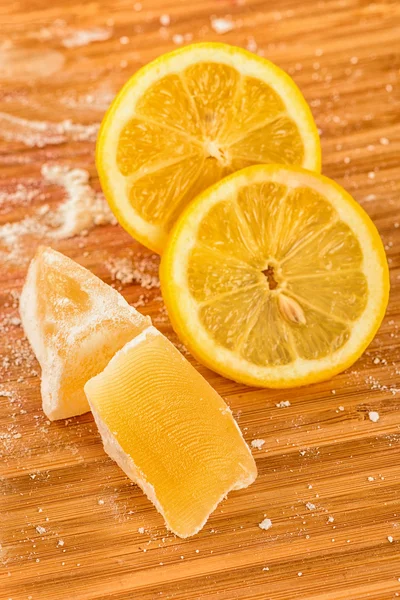 Turkish delight and lemon isolated on wooden background — Stock Photo, Image