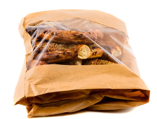 Closeup of three bagels in a brown paper bag — Stock Photo, Image