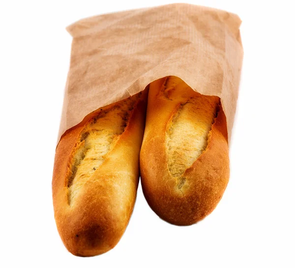 Verpakt in een papieren zak geïsoleerd op het wit brood — Stockfoto