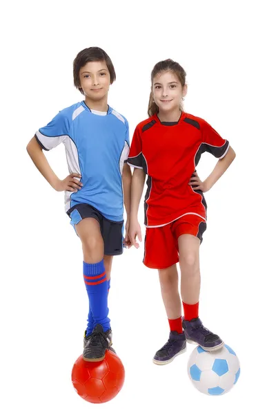 Couple of girl and boy dressed in soccer equipment — Stock Photo, Image