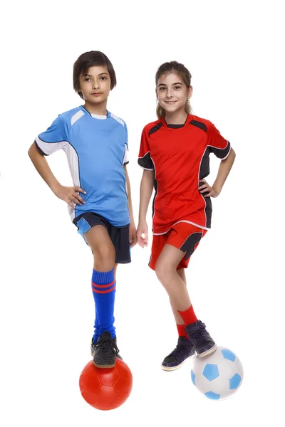 Coppia di ragazza e ragazzo vestito in attrezzature di calcio — Foto Stock