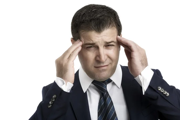Close-up de um homem de negócios com dor de cabeça em um escritório brilhante — Fotografia de Stock