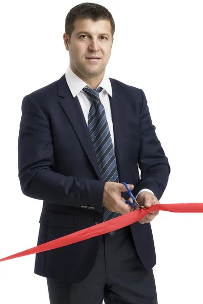 A man cutting a red ribbon, opening ceremony, isolated on white — Stock Photo, Image