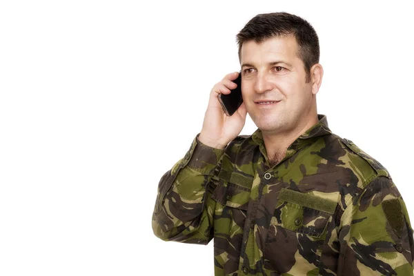 Smiling army veteran on the phone — Stock Photo, Image