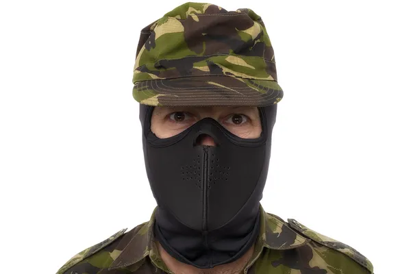 Portrait of a serious soldier standing against a white backgroun — Stock Photo, Image