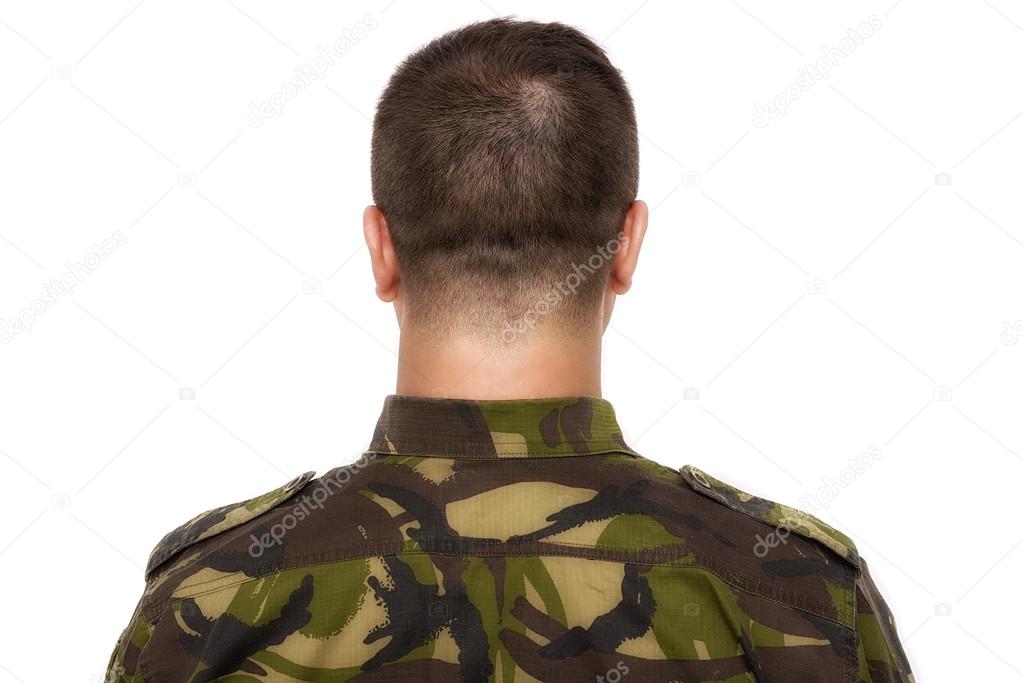 Soldier in camouflage standing on a white background