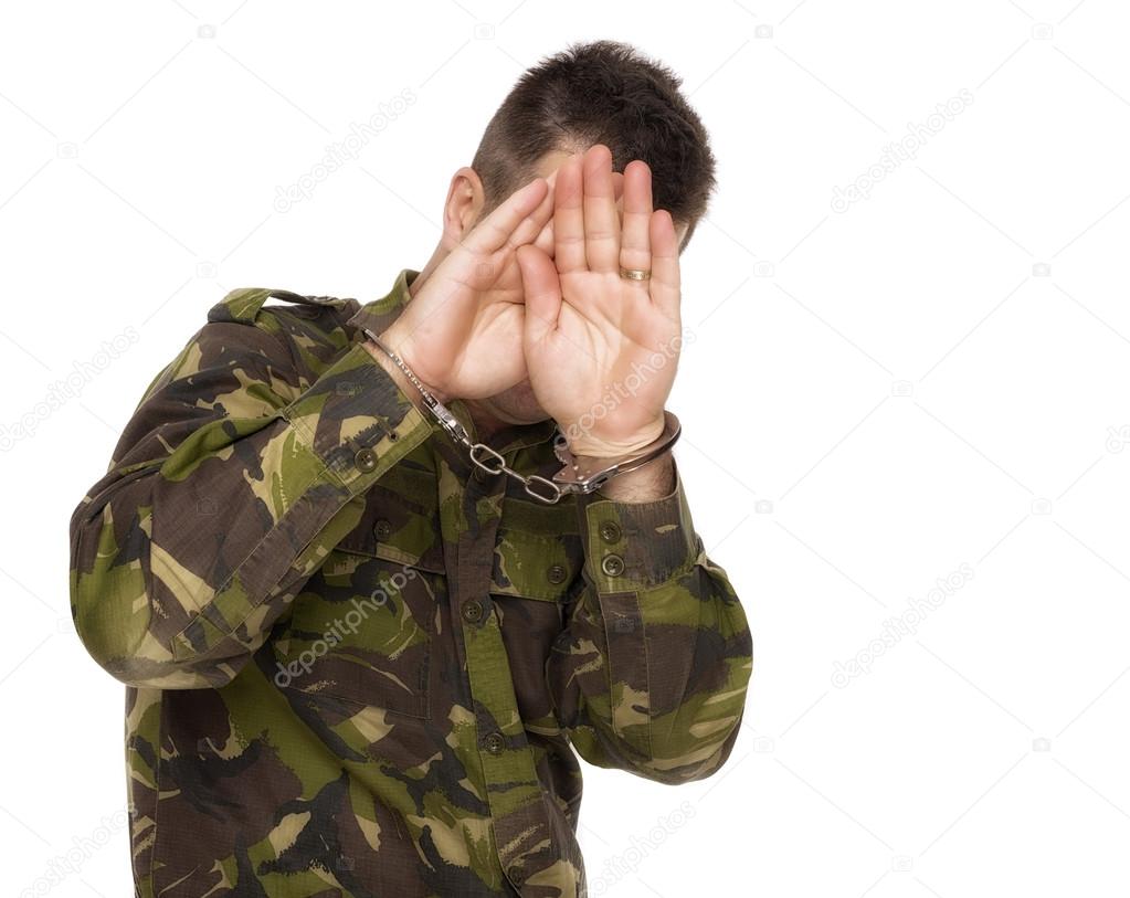 soldier hiding his face to not be filmed