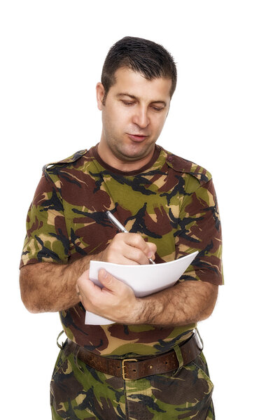 soldier who writes something on paper