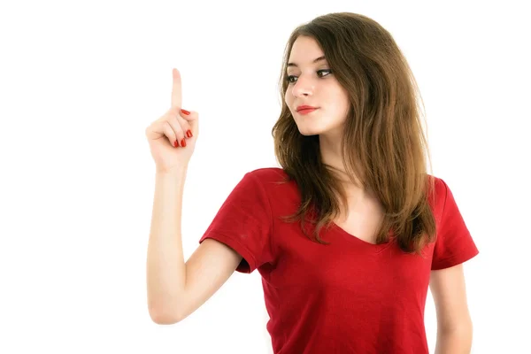 Young smiling woman points a hand with positive facial expressio — Stock Photo, Image