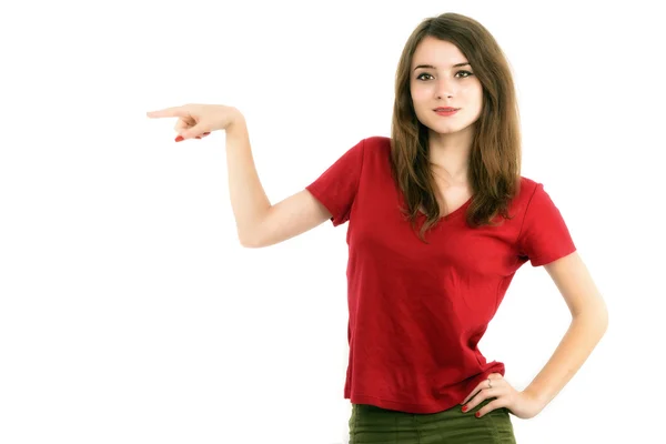 Young smiling woman points a hand with positive facial expressio — Stock Photo, Image