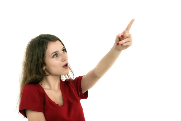 Young smiling woman points a hand with positive facial expressio — Stock Photo, Image