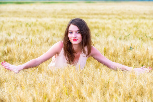 beautiful woman posing in wheat field