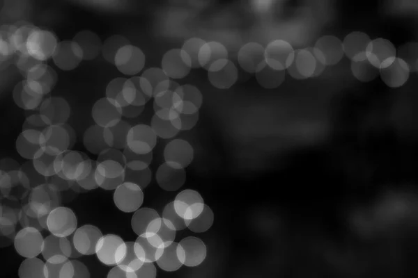 Fondo bokeh negro creando un efecto oscuro abstracto — Foto de Stock