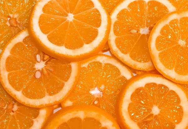 Фон оранжевых ломтиков — стоковое фото