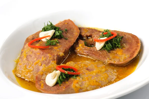 Stewed slices of beef tongue with sauce and seasoning — Stock Photo, Image