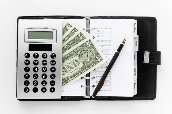 Pocket planner with pen and money — Stock Photo, Image