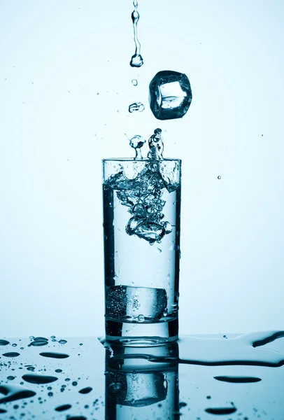 Splash in glass with water — Stock Photo, Image