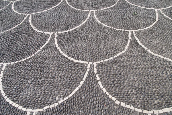 Paved street with scalloped design — Stock Photo, Image