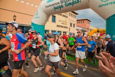 CORRALEJO - NOVEMBER 03: Runners start the race at Fourth intern clipart