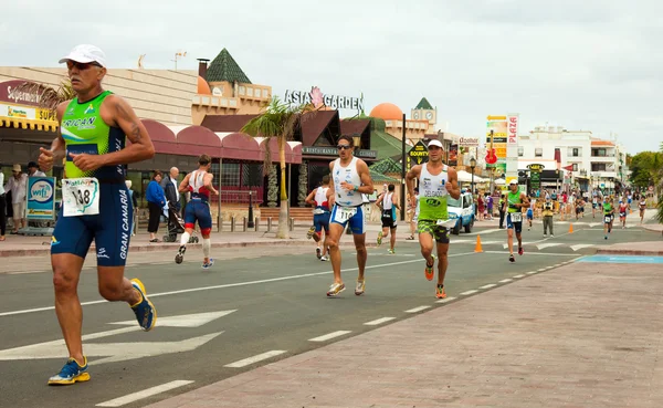 CORRALEJO - April 07: Participants at the running part of the ra — Stock Photo, Image