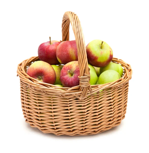 Wicker basket full of apples — Stock Photo, Image