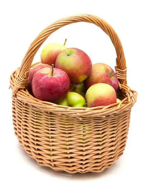 Wicker basket full of apples — Stock Photo, Image